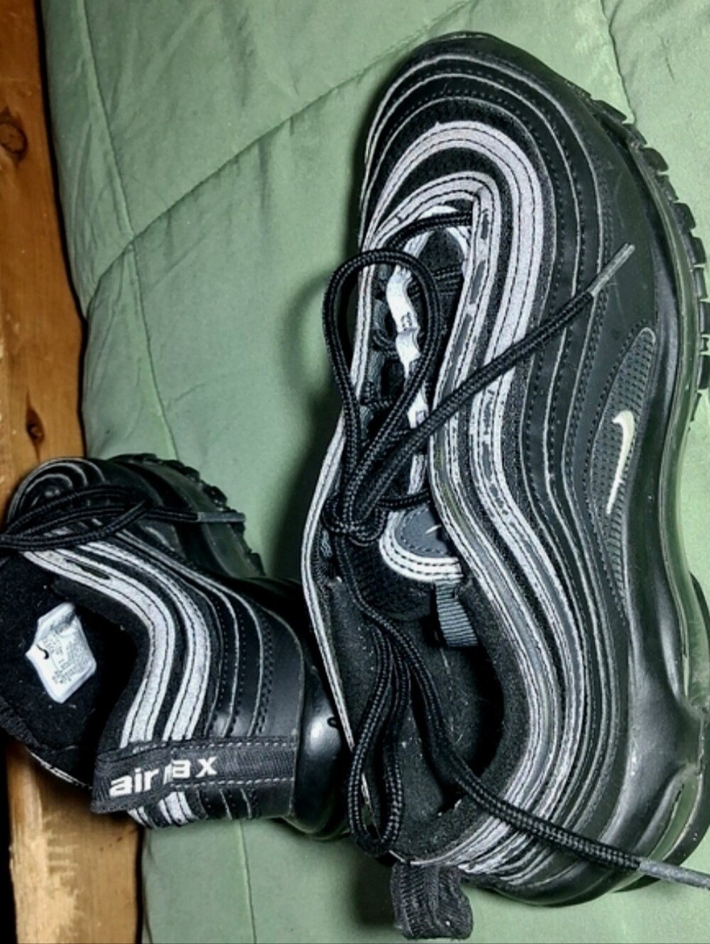 Nike Air Max 97 – Kids Size 4.Nike Kids Black Low-Top Sneakers with White Swoosh